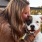 Girl kissing her dog